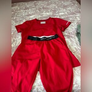 Scrubs top and bottom size small joggers and Medium top set